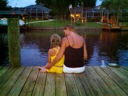 Photo of people sitting on a dock
